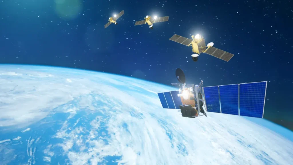 A photo of four satellites orbiting closely together over Earth